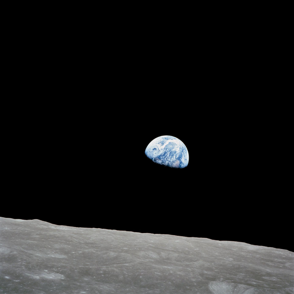 Earthrise, Apollo 8, in the Nous recipe: carbon black space, vermilion signal on the limb