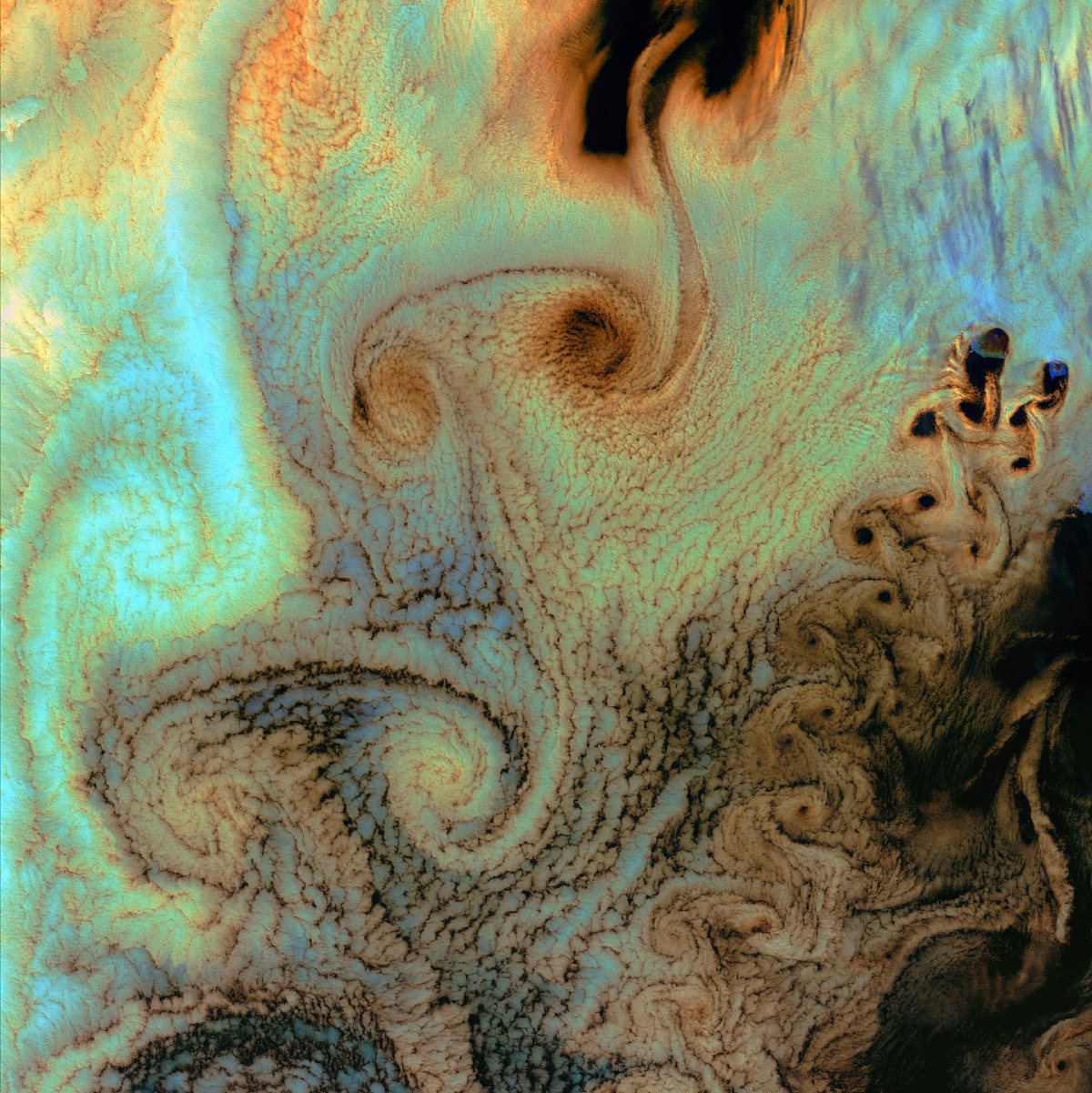 Von Kármán cloud vortices photographed by Landsat, drifting almost imperceptibly